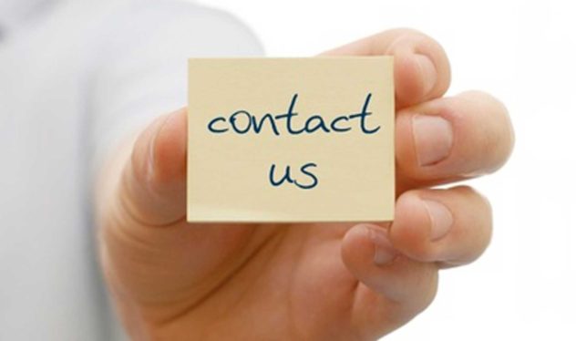 Contact Us - Hand Holding Post-It note